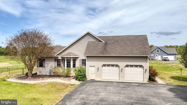 28342 Discount Land Rd, Laurel, DE 19956 - view of front of property featuring fence, a shingled roof, a garage, driveway, and a front yard