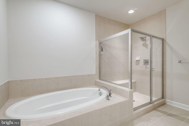 bathroom featuring tile patterned floors, a garden tub, a shower stall, and recessed lighting