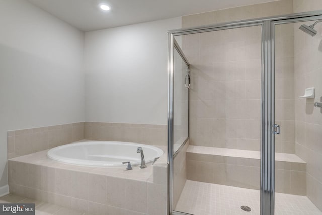 full bath featuring a shower stall, recessed lighting, and a bath