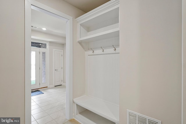 mudroom featuring visible vents, baseboards, and light tile patterned flooring