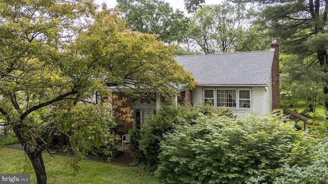 43 Harriet Rd, Southampton, PA 18966 - view of home's exterior with a chimney and roof with shingles