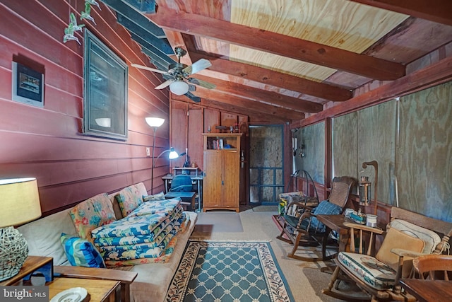 interior space with vaulted ceiling with beams, wood ceiling, ceiling fan, and wooden walls