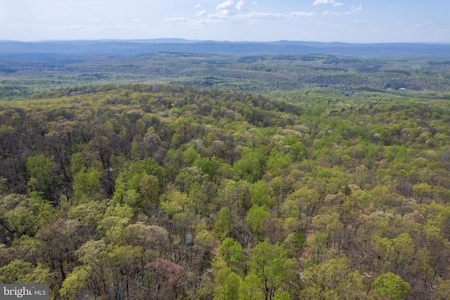 aerial view featuring a mountain view and a forest view