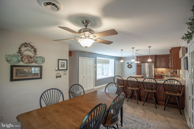 1701 Holicong Rd, New Hope, PA 18938 - dining area with baseboards, ceiling fan, and light wood-type flooring