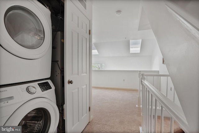 4223 N Carlin Springs Rd, Arlington, VA 22203 - washroom with stacked washer / drying machine, a skylight, and carpet floors