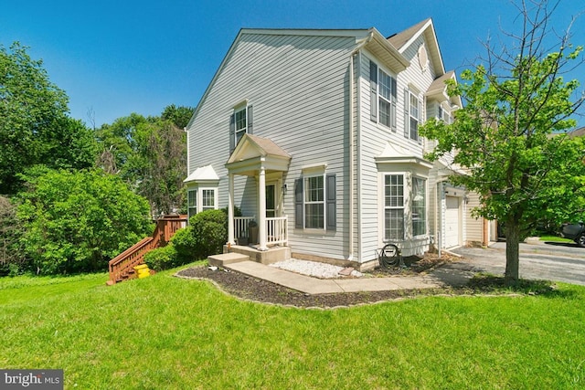 330 Timberbrook Ct, Odenton, MD 21113 - back of property featuring a yard and asphalt driveway