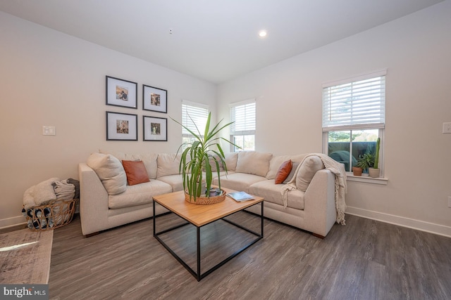 living area featuring baseboards, recessed lighting, and wood finished floors
