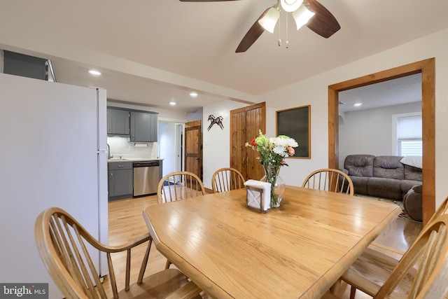 dining space with ceiling fan, recessed lighting, and light wood-style flooring