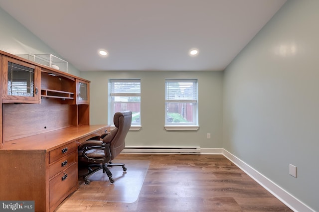 office area with baseboards, recessed lighting, wood finished floors, and a baseboard heating unit