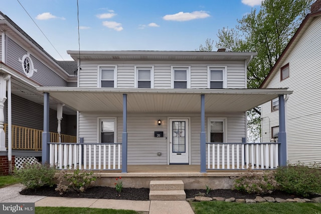 view of front of property featuring covered porch