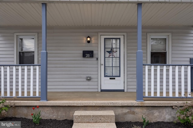 doorway to property featuring a porch