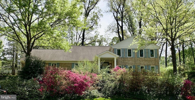 view of front of home featuring brick siding