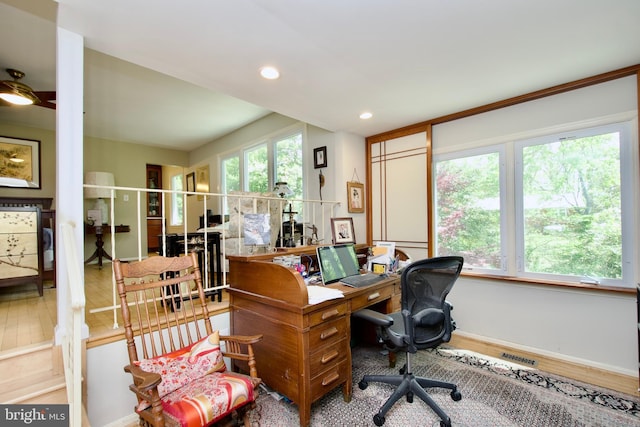 office with baseboards, visible vents, wood finished floors, and recessed lighting