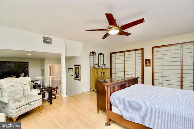 bedroom with a ceiling fan, visible vents, baseboards, and light wood-type flooring