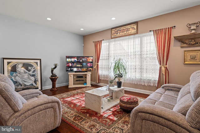 living room with baseboards, recessed lighting, and wood finished floors