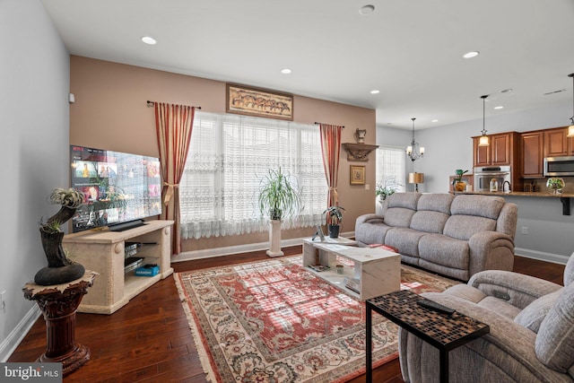 living area featuring baseboards, recessed lighting, and dark wood-type flooring