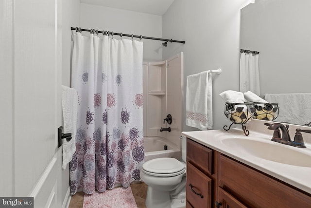 bathroom featuring vanity, shower / tub combo with curtain, tile patterned floors, and toilet