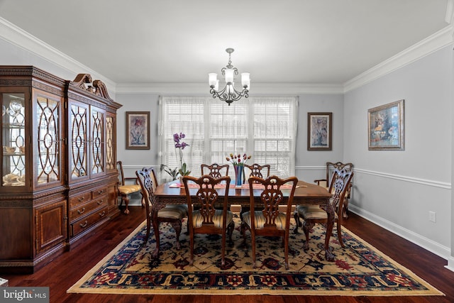 dining space featuring crown molding, baseboards, a notable chandelier, and dark wood-style floors