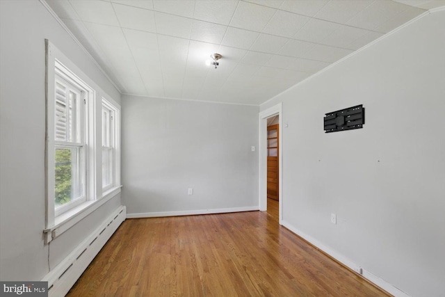 103 Pleasure Rd, Lancaster, PA 17601 - empty room with baseboards, a baseboard radiator, wood finished floors, and ornamental molding