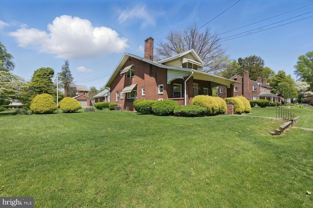 103 Pleasure Rd, Lancaster, PA 17601 - view of property exterior with brick siding, a lawn, and a chimney