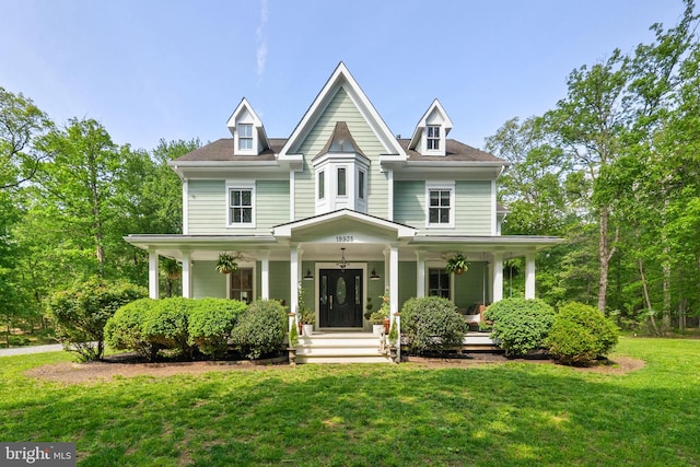 view of front of home featuring a porch and a front yard