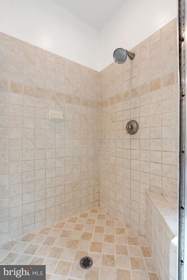 bathroom with tiled shower