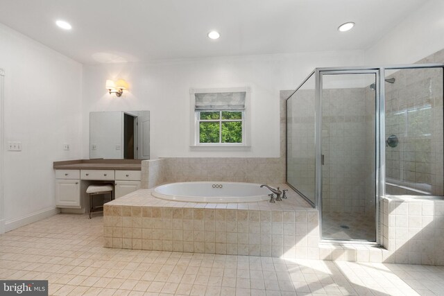 full bathroom with a garden tub, a shower stall, vanity, tile patterned floors, and recessed lighting