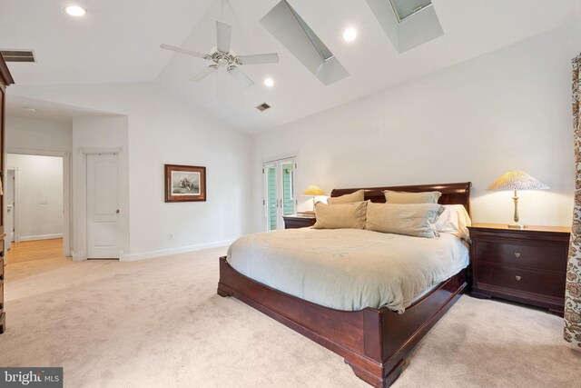bedroom featuring light colored carpet, high vaulted ceiling, and visible vents