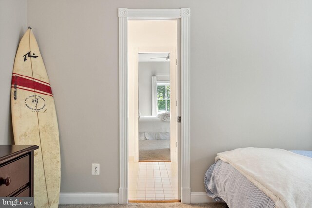 bedroom featuring carpet floors and baseboards