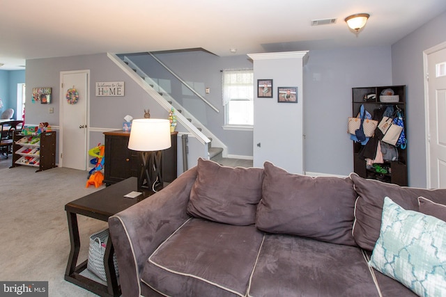living room with stairway and carpet floors