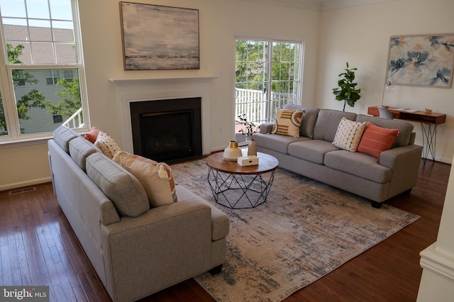 2725 Shelburne Rd, Downingtown, PA 19335 - living room featuring baseboards, a fireplace with flush hearth, visible vents, and hardwood / wood-style floors
