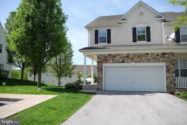 2725 Shelburne Rd, Downingtown, PA 19335 - traditional-style home featuring an attached garage, a front lawn, aphalt driveway, and stone siding