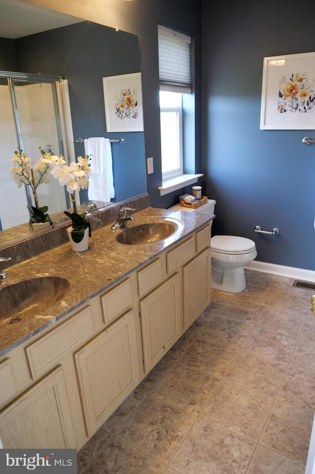 2725 Shelburne Rd, Downingtown, PA 19335 - bathroom featuring visible vents, a sink, double vanity, and toilet