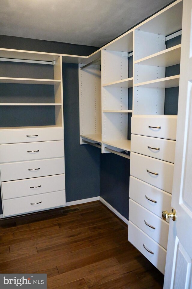 2725 Shelburne Rd, Downingtown, PA 19335 - walk in closet with dark wood-type flooring