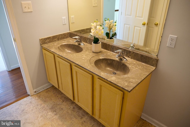 2725 Shelburne Rd, Downingtown, PA 19335 - bathroom with double vanity, a sink, and baseboards