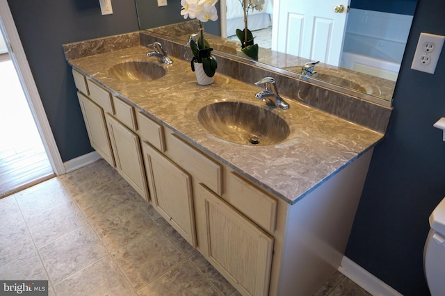 2725 Shelburne Rd, Downingtown, PA 19335 - full bathroom featuring a sink, baseboards, and double vanity