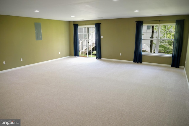 2725 Shelburne Rd, Downingtown, PA 19335 - unfurnished room with baseboards, recessed lighting, electric panel, and light colored carpet