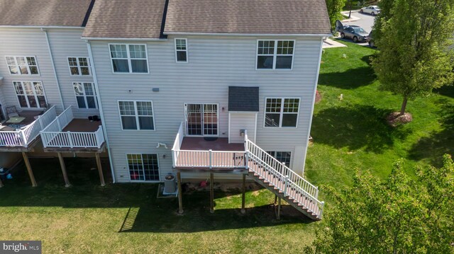 2725 Shelburne Rd, Downingtown, PA 19335 - back of house featuring a lawn, a shingled roof, a deck, and stairway