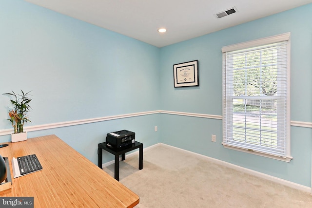 unfurnished office with carpet flooring, recessed lighting, baseboards, and visible vents