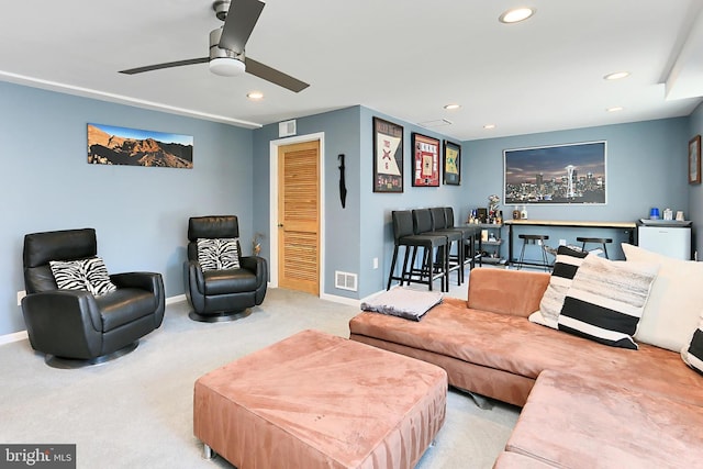 carpeted living room with visible vents, recessed lighting, baseboards, and ceiling fan