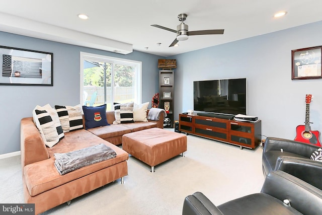 carpeted living room featuring baseboards, a ceiling fan, and recessed lighting