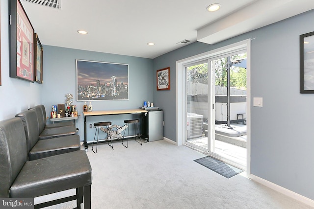 carpeted office space with visible vents, recessed lighting, and baseboards
