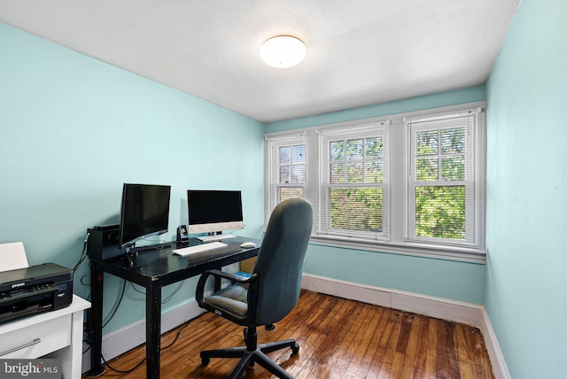 office space featuring baseboards and hardwood / wood-style flooring