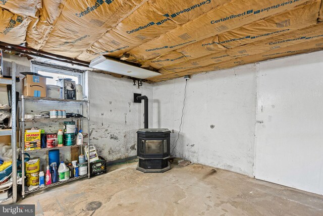 basement featuring a wood stove