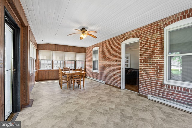 sunroom with a baseboard radiator, outdoor dining space, and ceiling fan