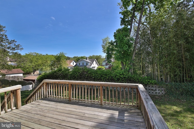 wooden terrace with a residential view