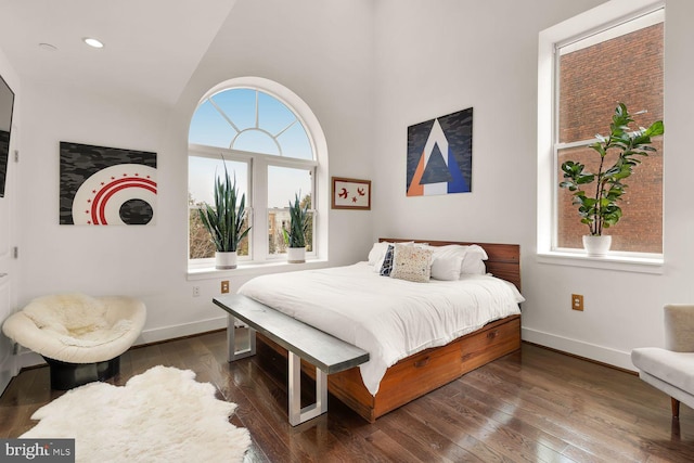1341 Maryland Ave NE Unit 103, Washington, DC 20002 - bedroom featuring wood-type flooring, baseboards, and multiple windows