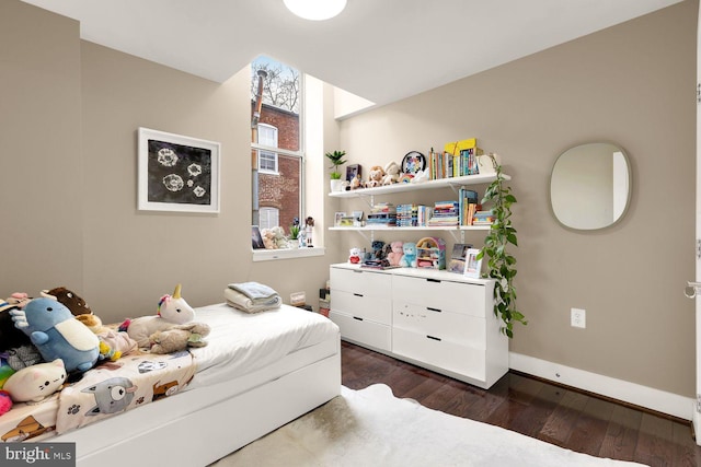 1341 Maryland Ave NE Unit 103, Washington, DC 20002 - bedroom with baseboards and dark wood-style floors