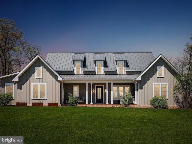551 Jacksons Chase Dr, Middletown, VA 22645 - view of front facade featuring board and batten siding, covered porch, a standing seam roof, metal roof, and a front lawn