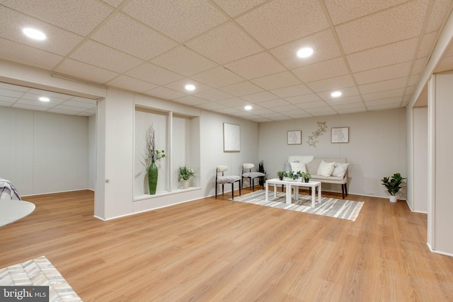 sitting room featuring recessed lighting, light wood-style flooring, and a drop ceiling
